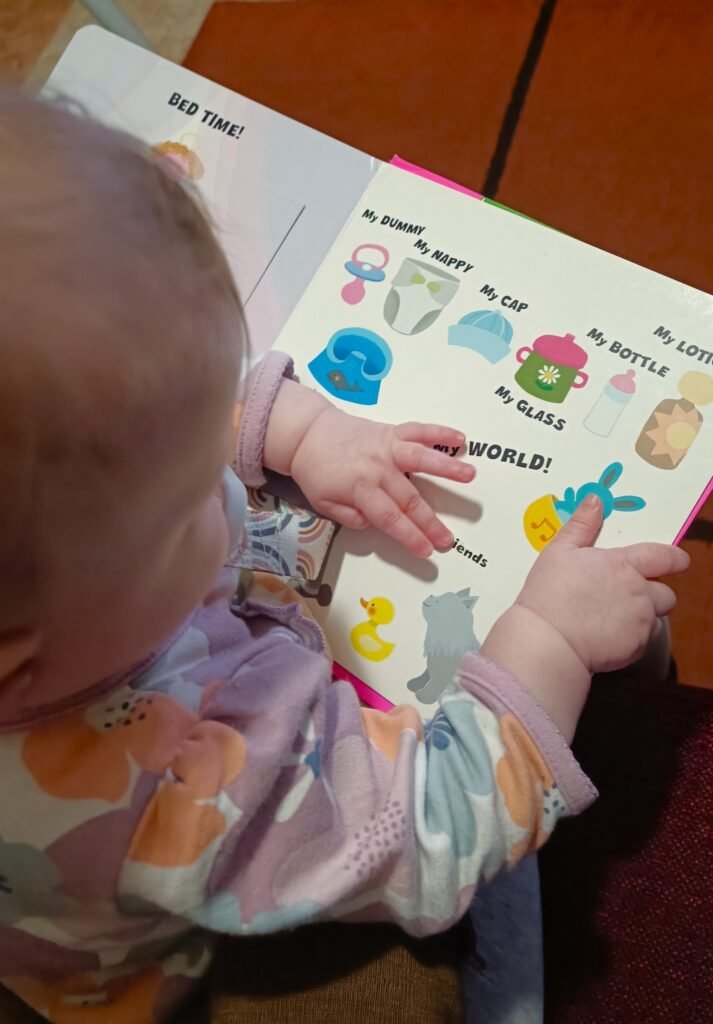 baby reading a book